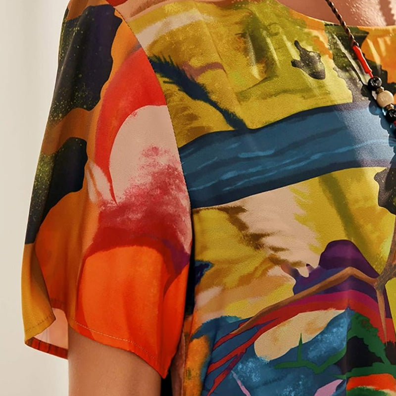 Nyelisse - Flowing dress in bright tropical colors